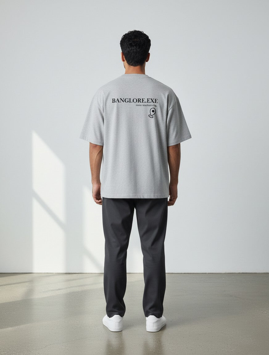 mi-DONE Bengaluru oversized grey cotton t-shirt with back graphic print worn by a man from behind
