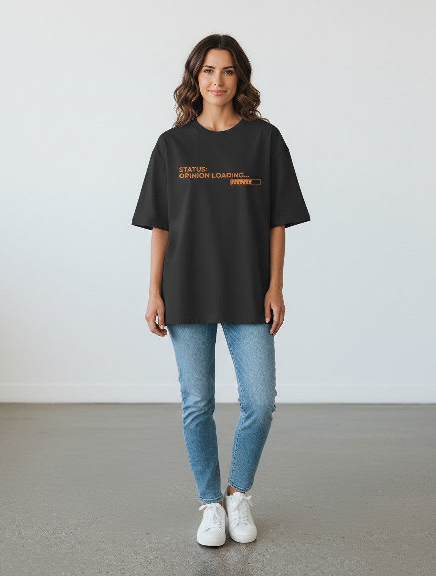 A woman wearing a black mi-DONE oversized cotton t-shirt with a graphic print that reads Status: Opinion Loading.
