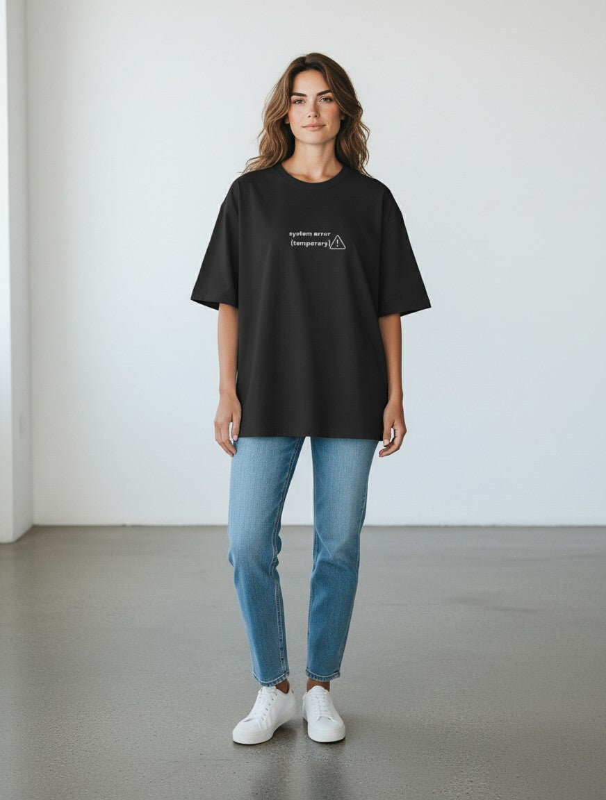 mi-DONE black oversized cotton t-shirt with Overstimulated graphic print worn by a woman with blue jeans