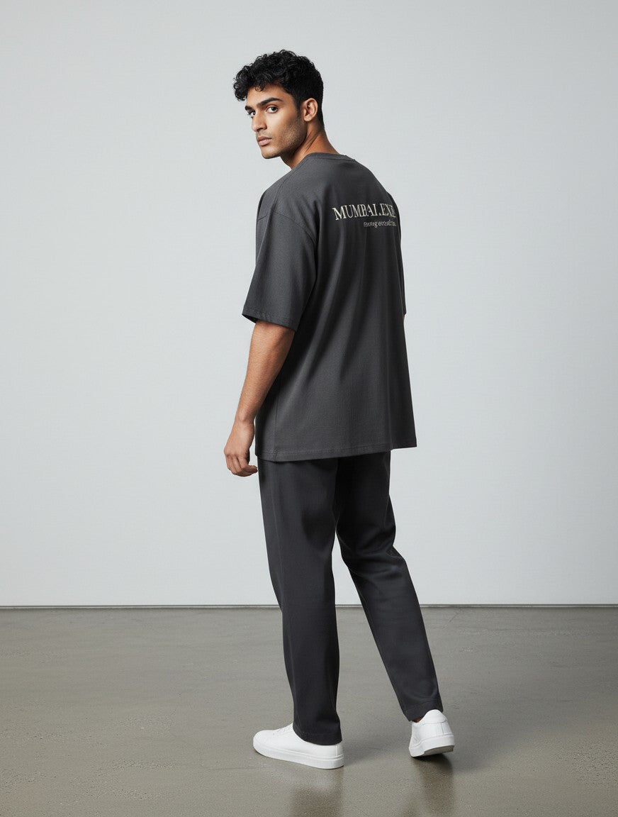 mi-DONE oversized charcoal grey cotton t-shirt with drop shoulders and back graphic print worn by a man