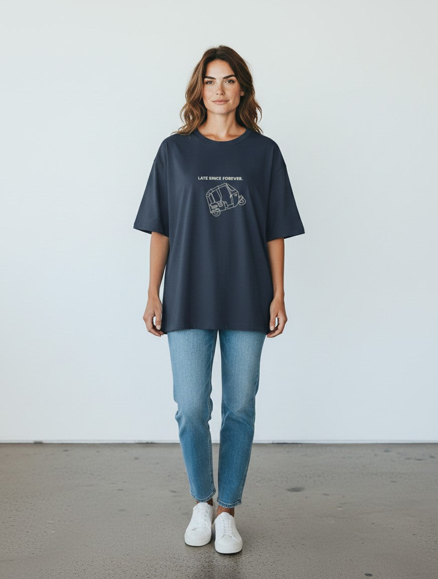 Woman wearing a charcoal grey mi-DONE oversized cotton t-shirt with a Late Since Forever rickshaw graphic print
