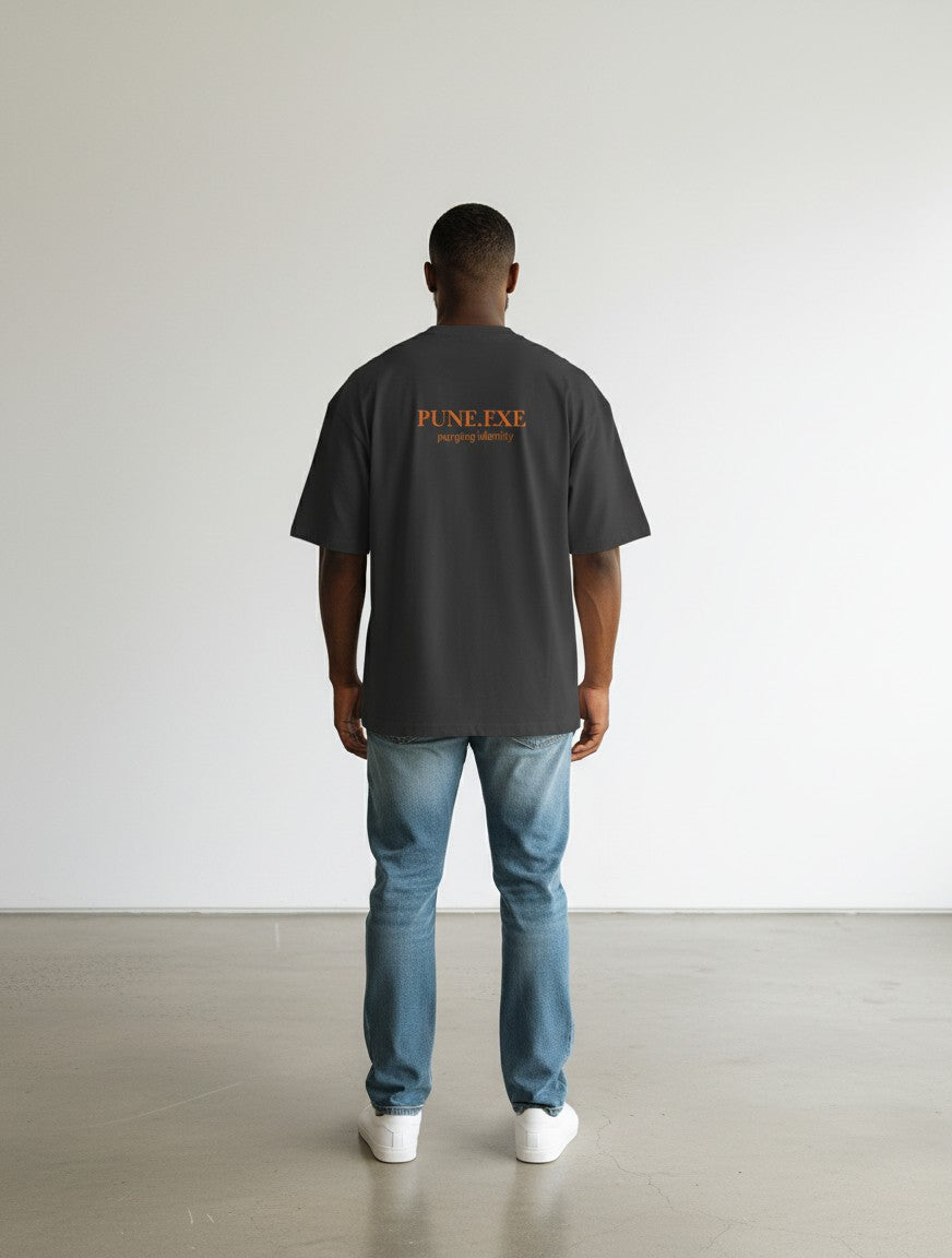 mi-DONE oversized charcoal grey cotton t-shirt with Pune.exe graphic on back worn by a man with blue jeans