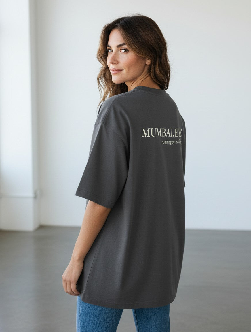 mi-DONE oversized charcoal grey cotton t-shirt with drop shoulders and graphic print on the back worn by a woman