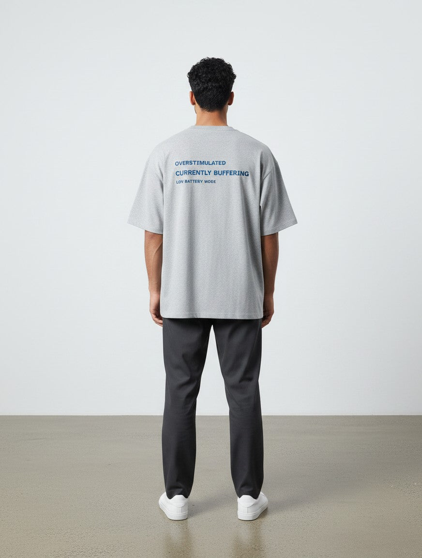 mi-DONE grey oversized cotton t-shirt with System Error text graphic on the back, worn by a man from behind