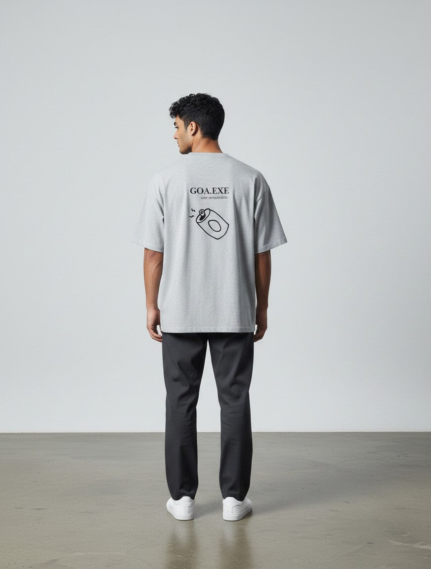 mi-DONE grey oversized cotton t-shirt with Goa graphic print on back, worn by a man with dark trousers