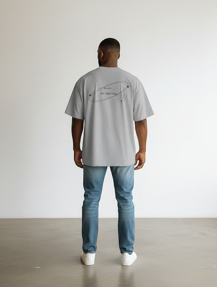 mi-DONE grey oversized cotton t-shirt with Delulu But Functional graphic print on the back worn by a man