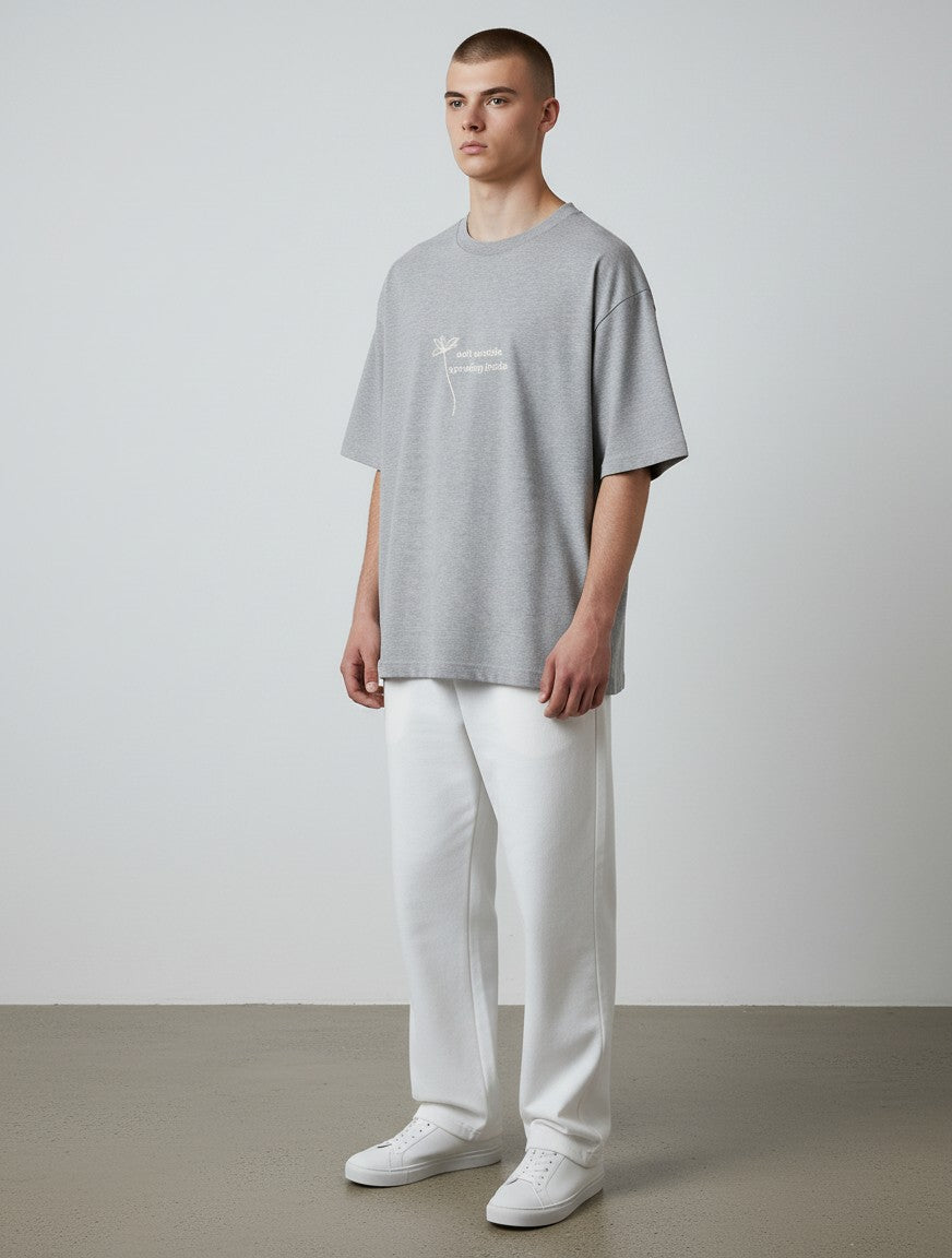 mi-DONE grey oversized cotton t-shirt with Flowers & Existential Dread graphic print worn by a male model