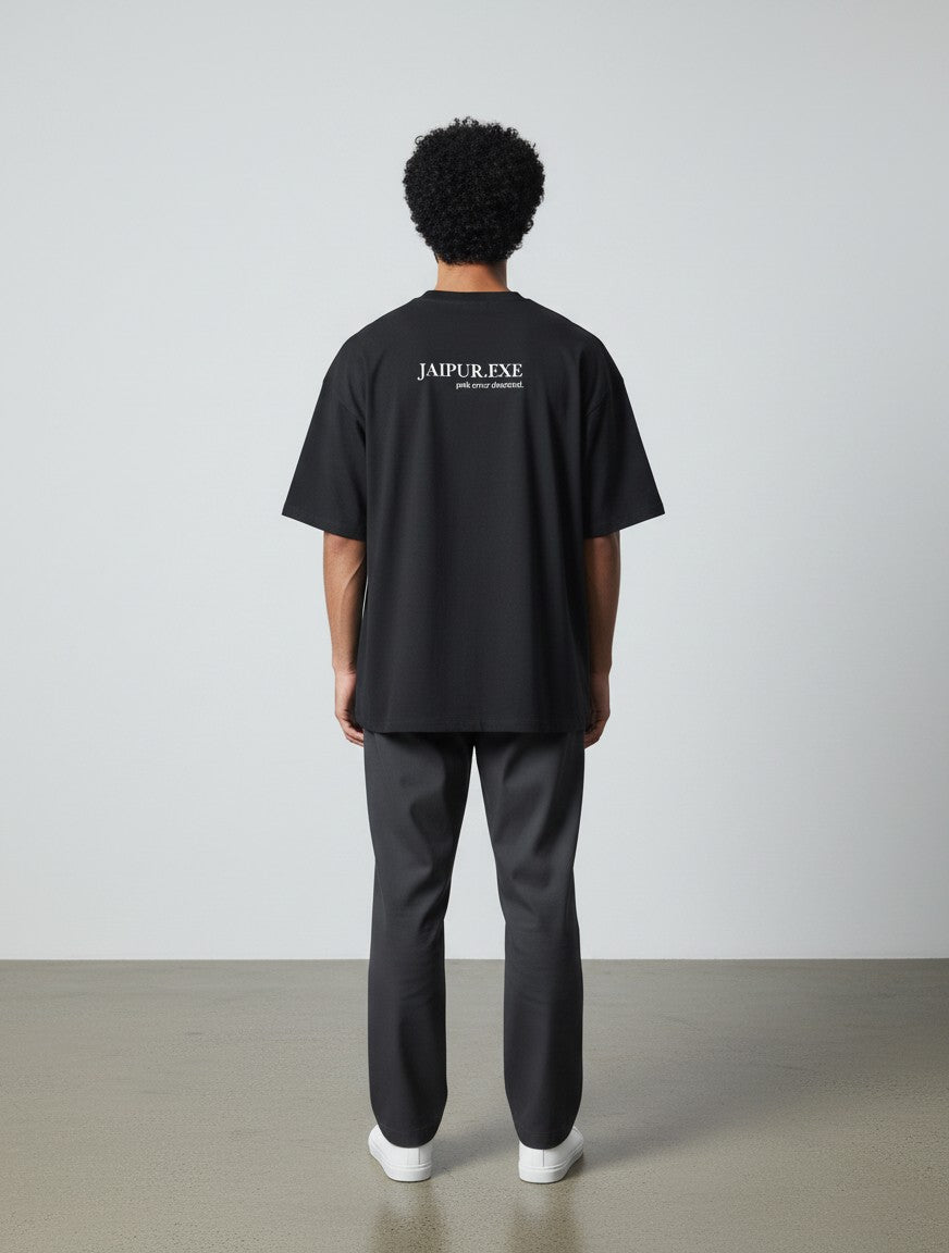 mi-DONE Jaipur oversized black cotton t-shirt with back graphic print worn by a man from the back view