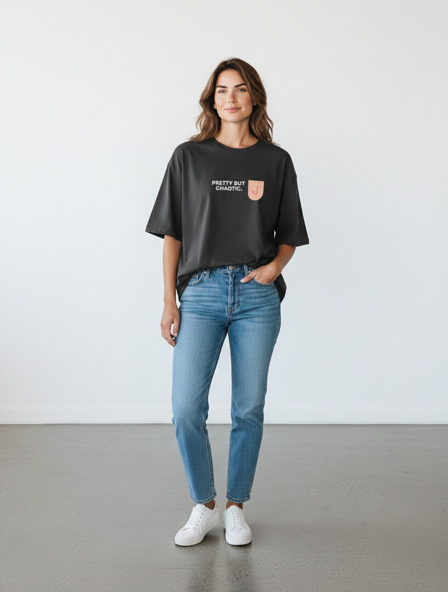 mi-DONE Jaipur oversized black cotton t-shirt with graphic print worn by a woman with blue jeans and white sneakers