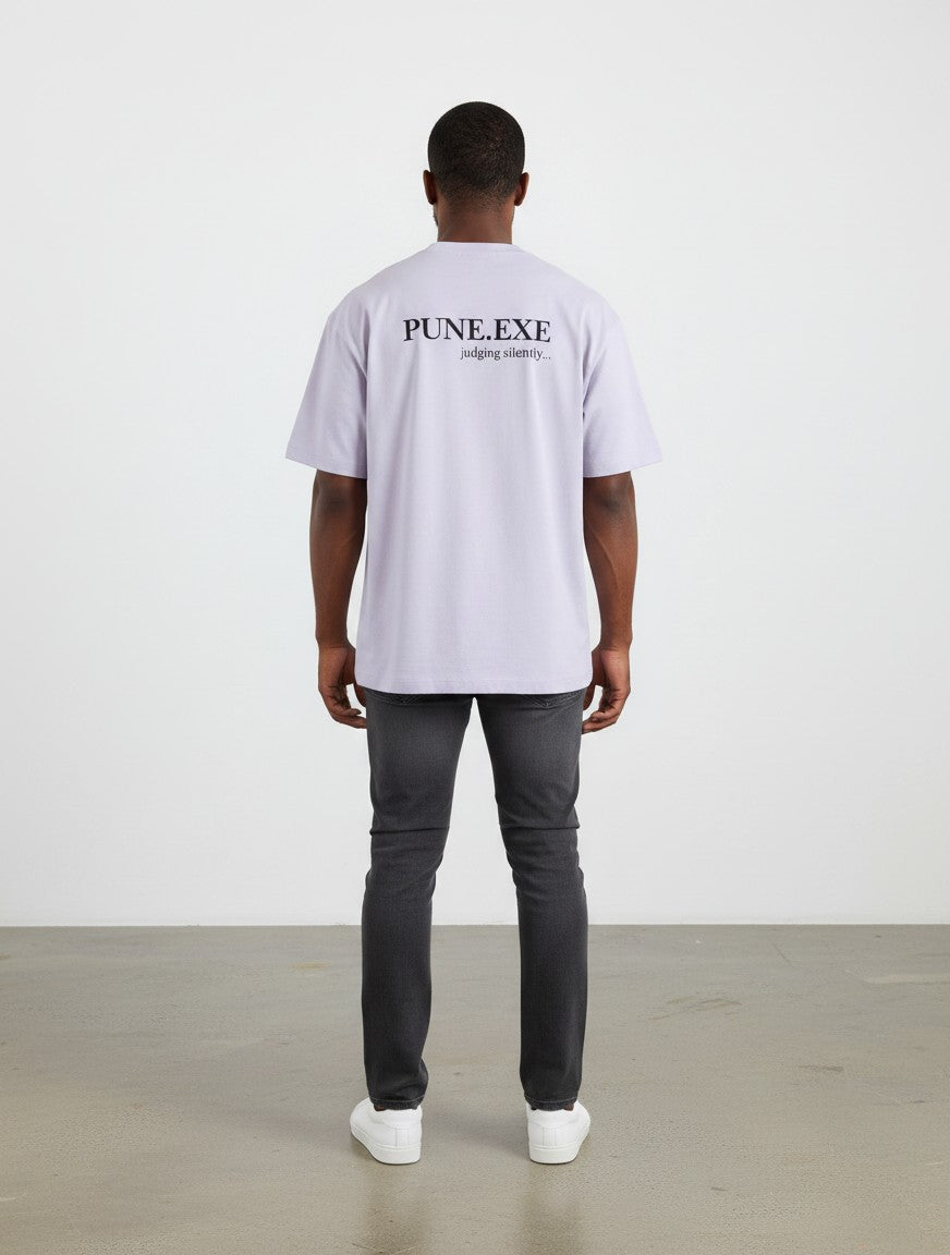 mi-DONE oversized lavender cotton t-shirt with PUNE.EXE graphic print on back worn by a man with dark jeans