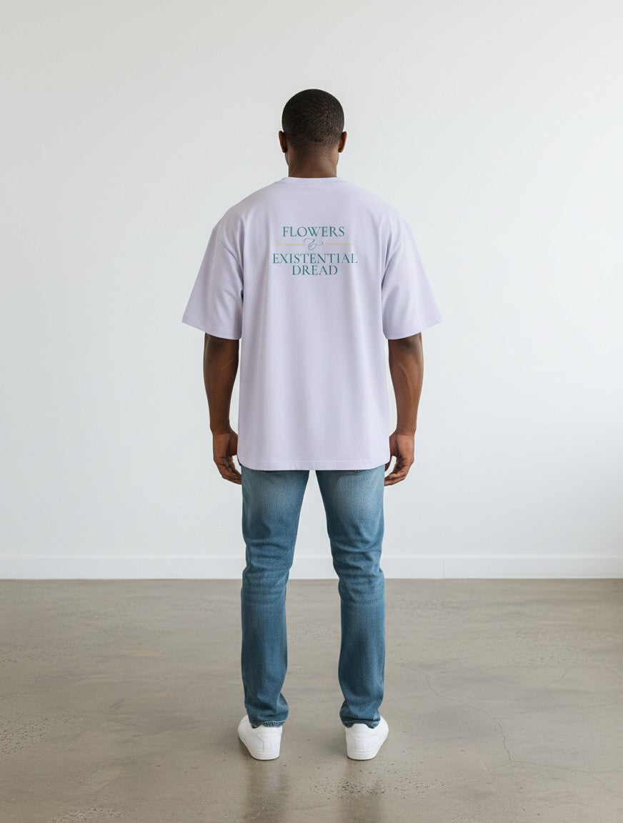 mi-DONE oversized lavender cotton t-shirt with back graphic print, worn by a man with blue jeans and white sneakers