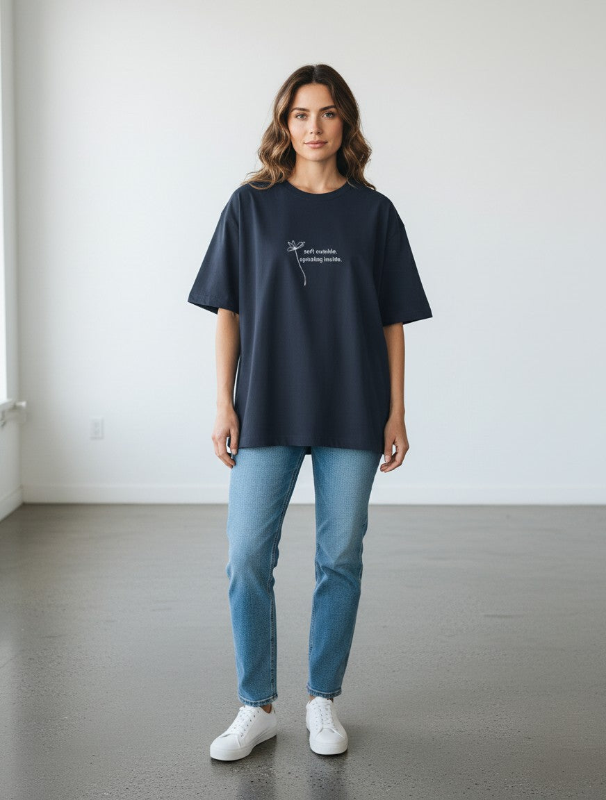 mi-DONE oversized navy blue cotton t-shirt with graphic print worn by a woman with jeans and white sneakers