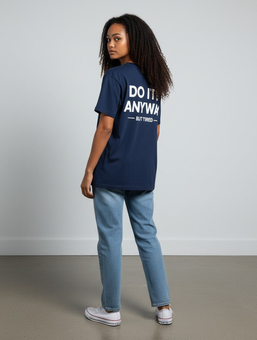 mi-DONE navy blue oversized cotton T-shirt with white back graphic text worn by a woman with jeans and sneakers