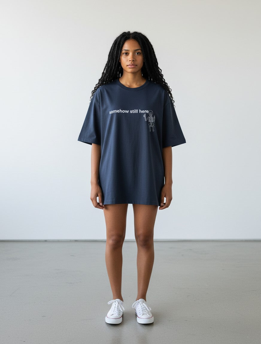 mi-DONE oversized navy blue cotton t-shirt with somehow still here skeleton graphic print on a model