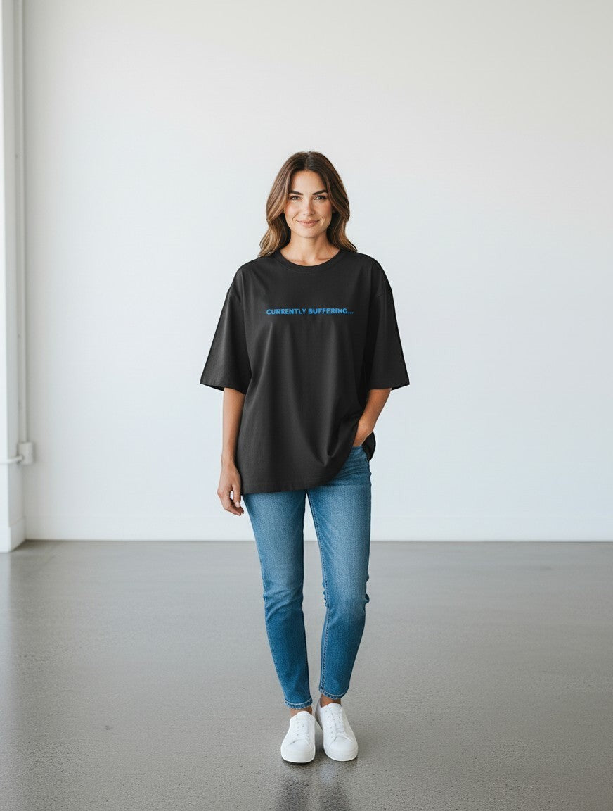 mi-DONE oversized black cotton t-shirt with Currently Buffering text, worn by a woman with blue jeans and sneakers