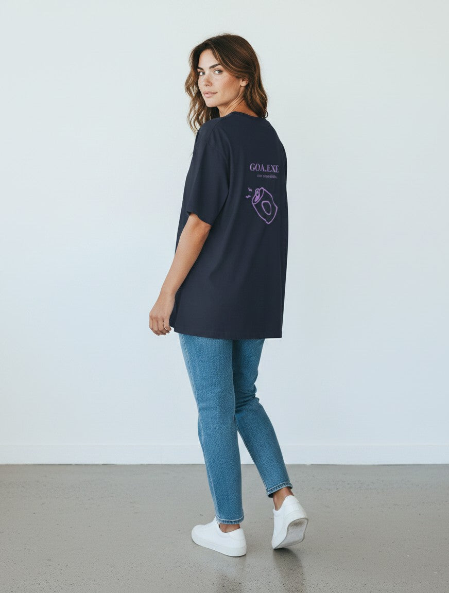 mi-DONE oversized black cotton t-shirt with back graphic print, worn by a woman with blue jeans and white sneakers.