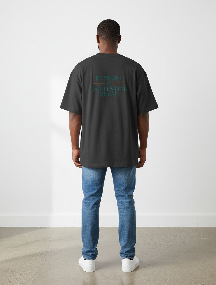 mi-DONE oversized black cotton t-shirt with back graphic print worn by a man with blue jeans