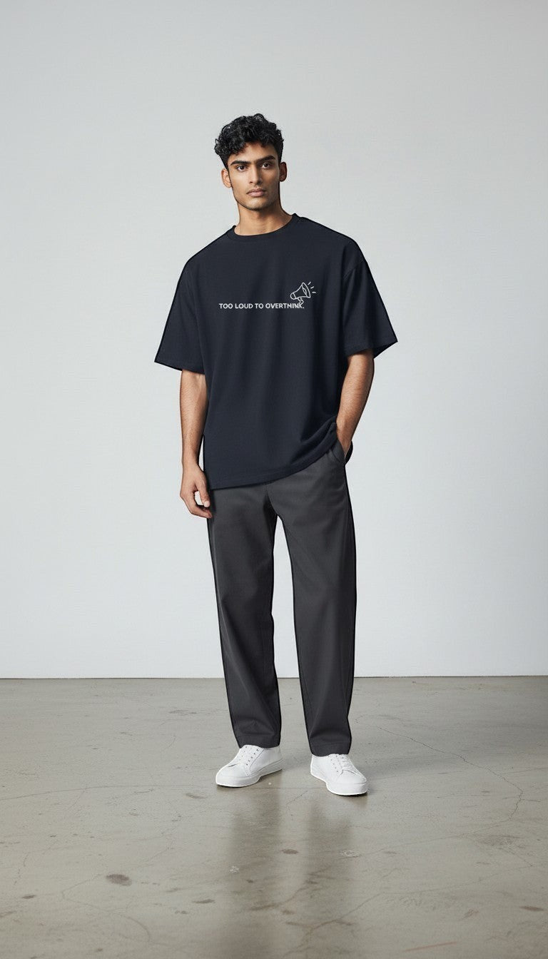 mi-DONE oversized black cotton t-shirt with Too Loud To Overthink graphic print worn by a male model