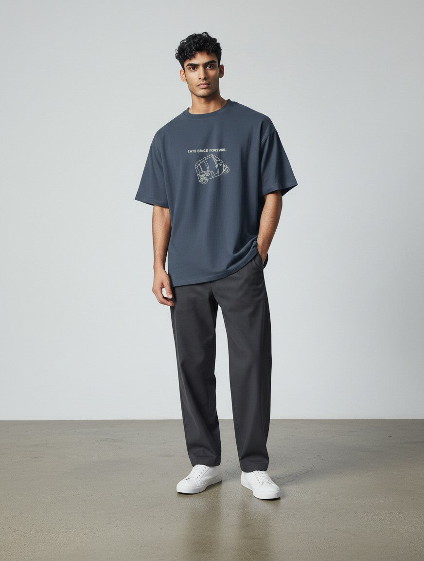 mi-DONE oversized charcoal grey cotton t-shirt with Late Since Forever graphic print worn by a man with dark trousers