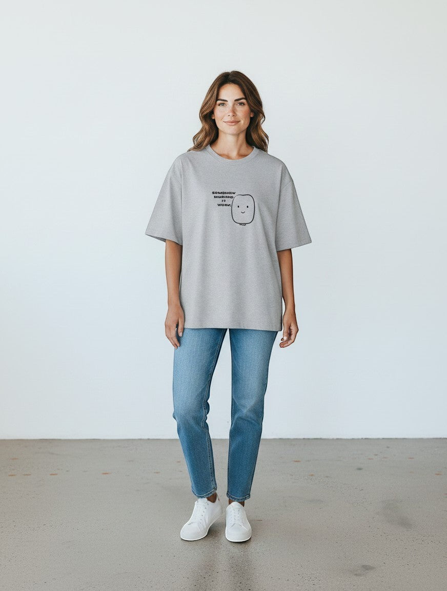 mi-DONE oversized grey cotton t-shirt with graphic print worn by a woman with blue jeans and white sneakers