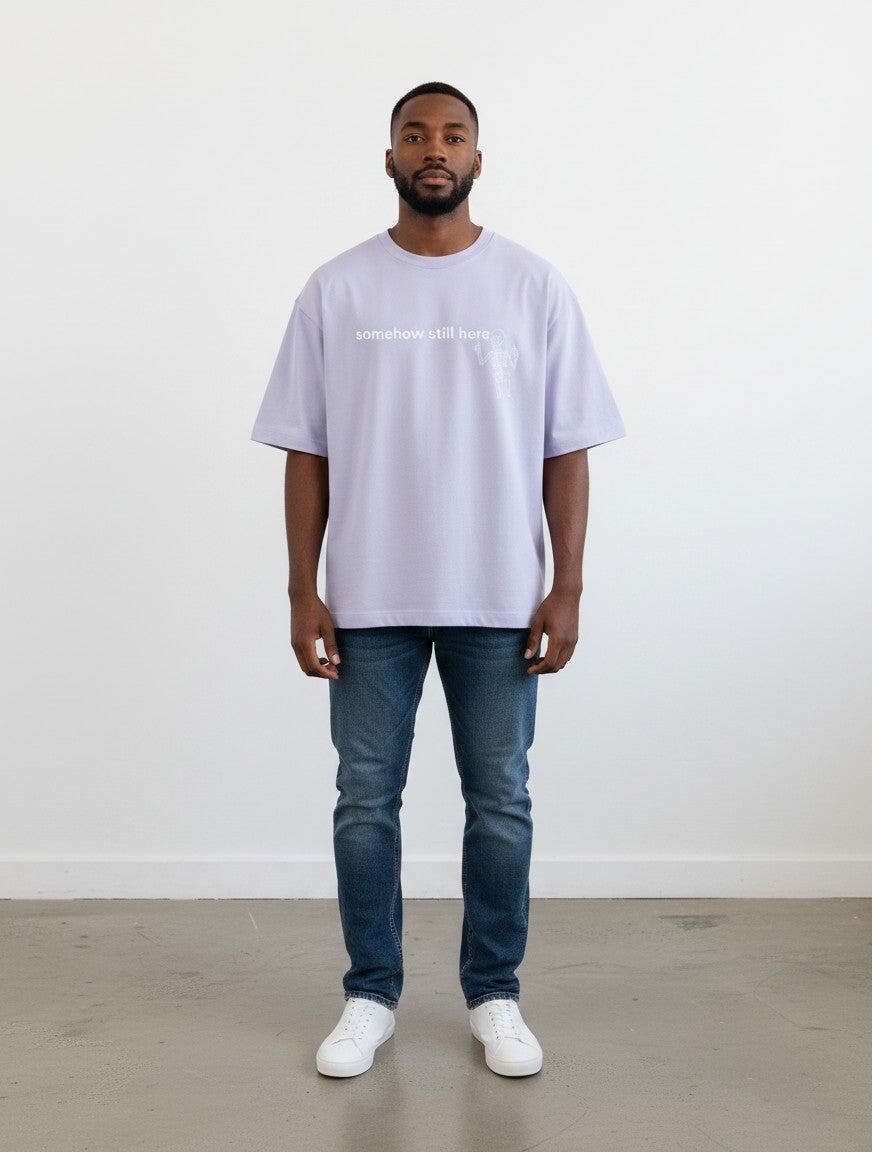 mi-DONE oversized lavender cotton t-shirt with drop shoulders and graphic print worn by a man with blue jeans