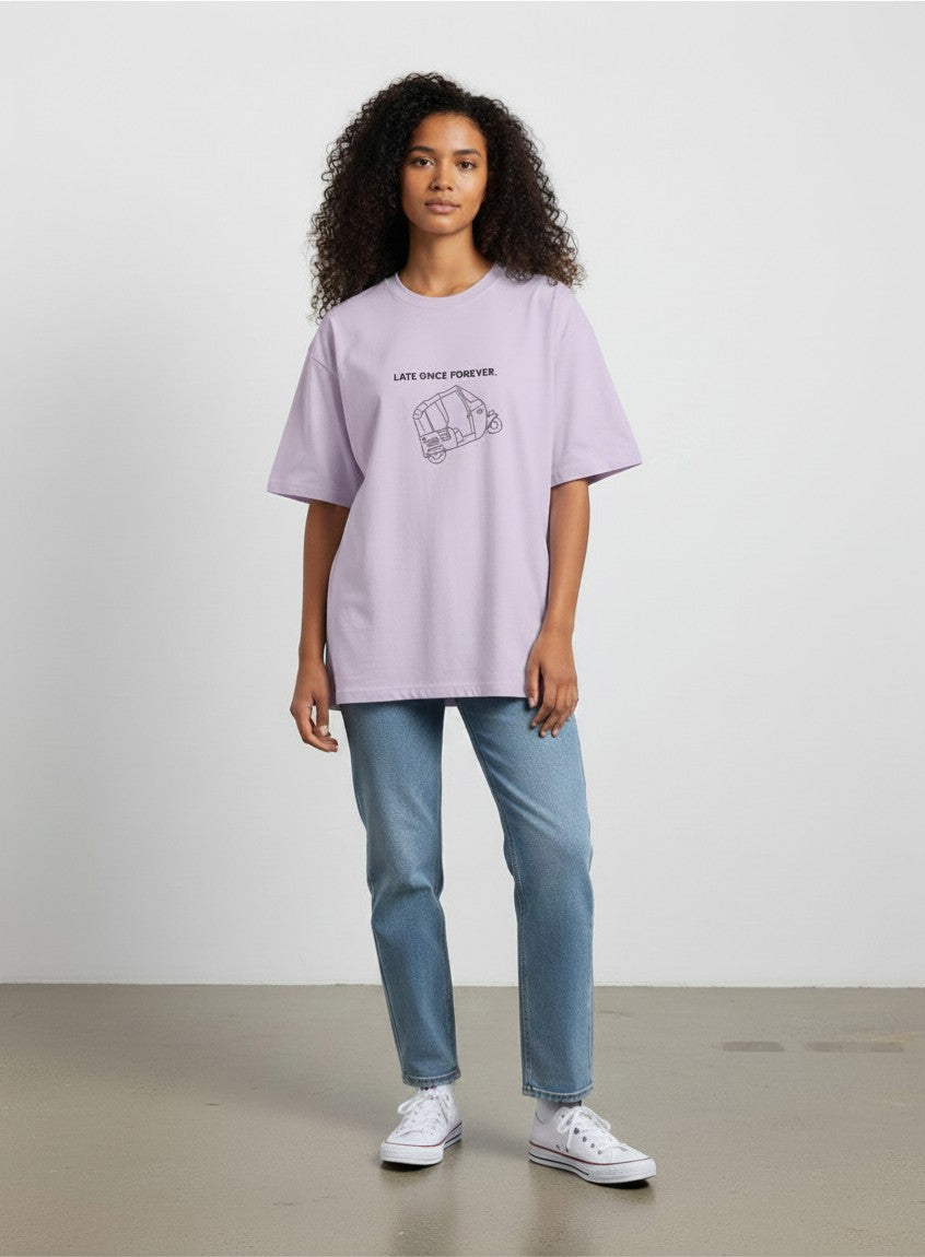 Model wearing a mi-DONE oversized lavender cotton t-shirt with a Mumbai rickshaw graphic and Late Once Forever text