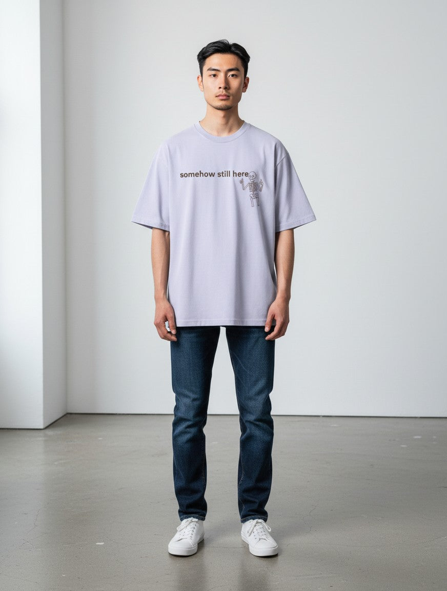 mi-DONE oversized lavender cotton t-shirt with a skeleton graphic print and drop shoulders worn by a male model