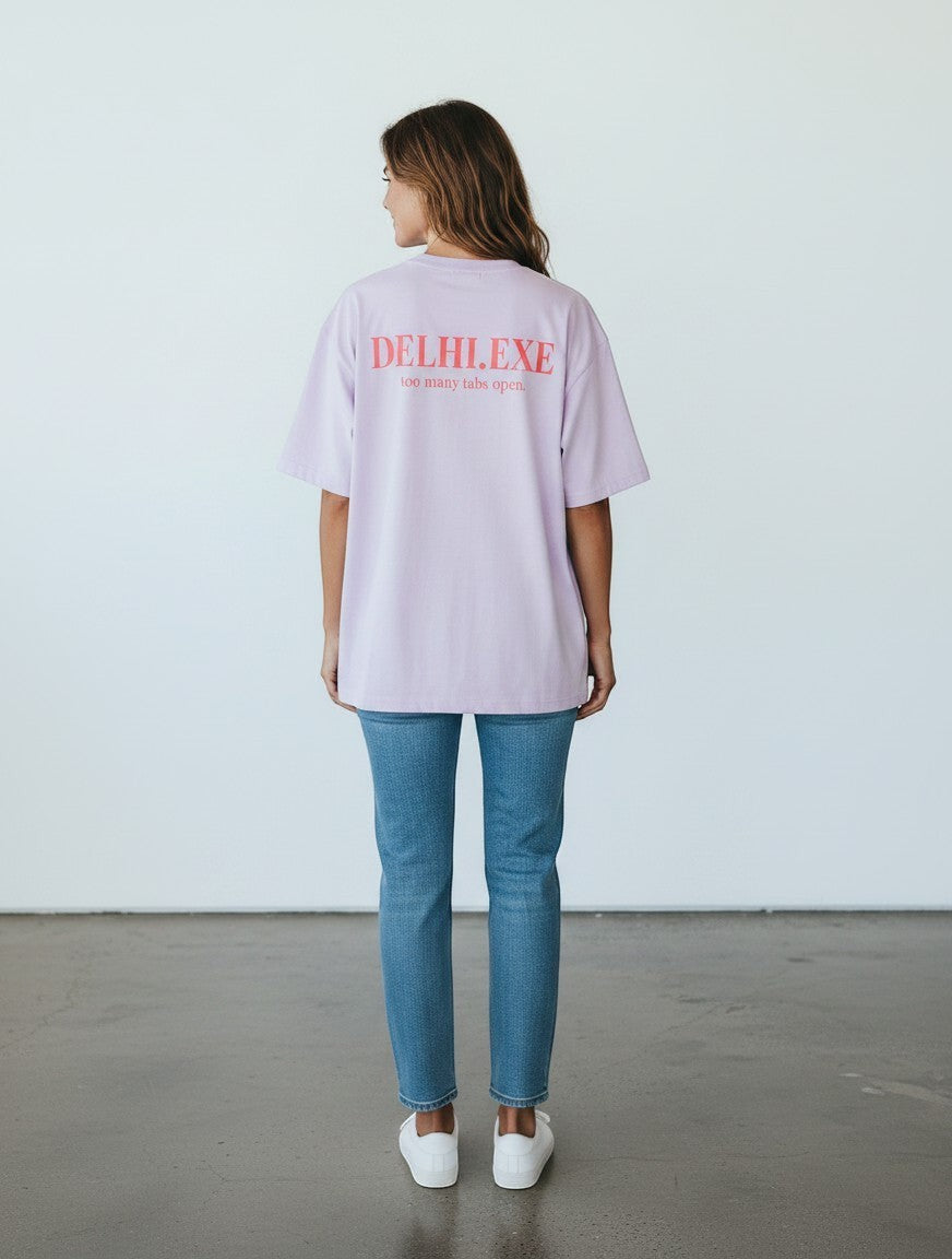 mi-DONE oversized lavender cotton t-shirt with Delhi.exe print on back, worn by a woman with blue jeans
