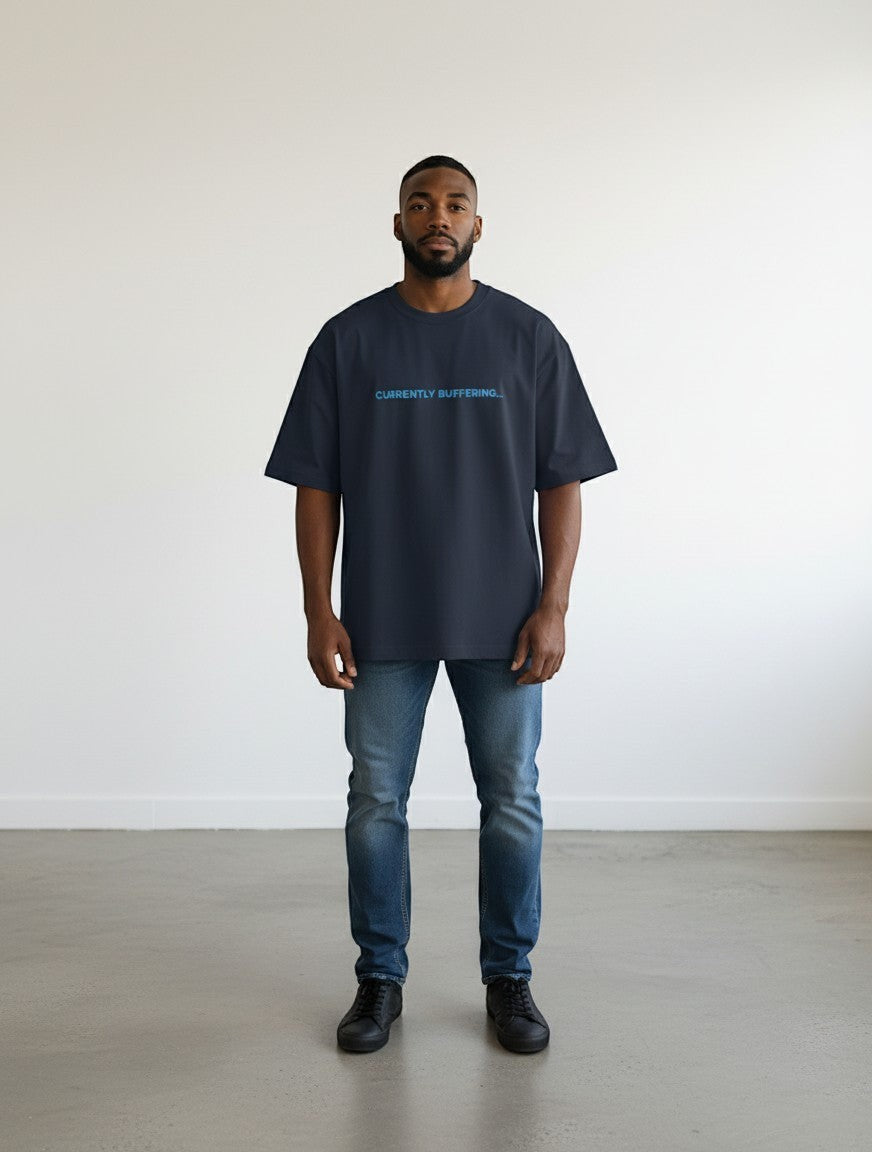 mi-DONE oversized navy blue cotton t-shirt with Currently Buffering text print, worn by a man with jeans.