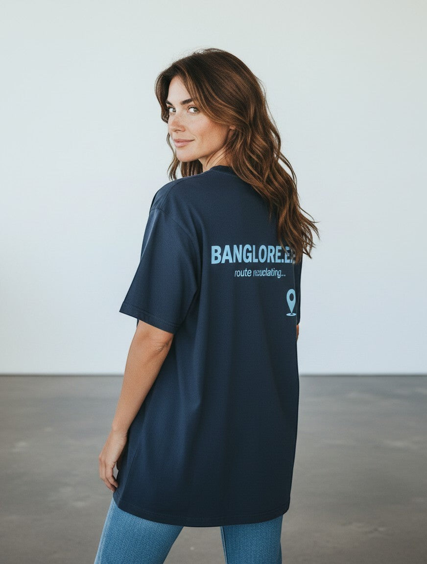 mi-DONE oversized navy blue cotton t-shirt with back graphic print worn by a woman looking over her shoulder