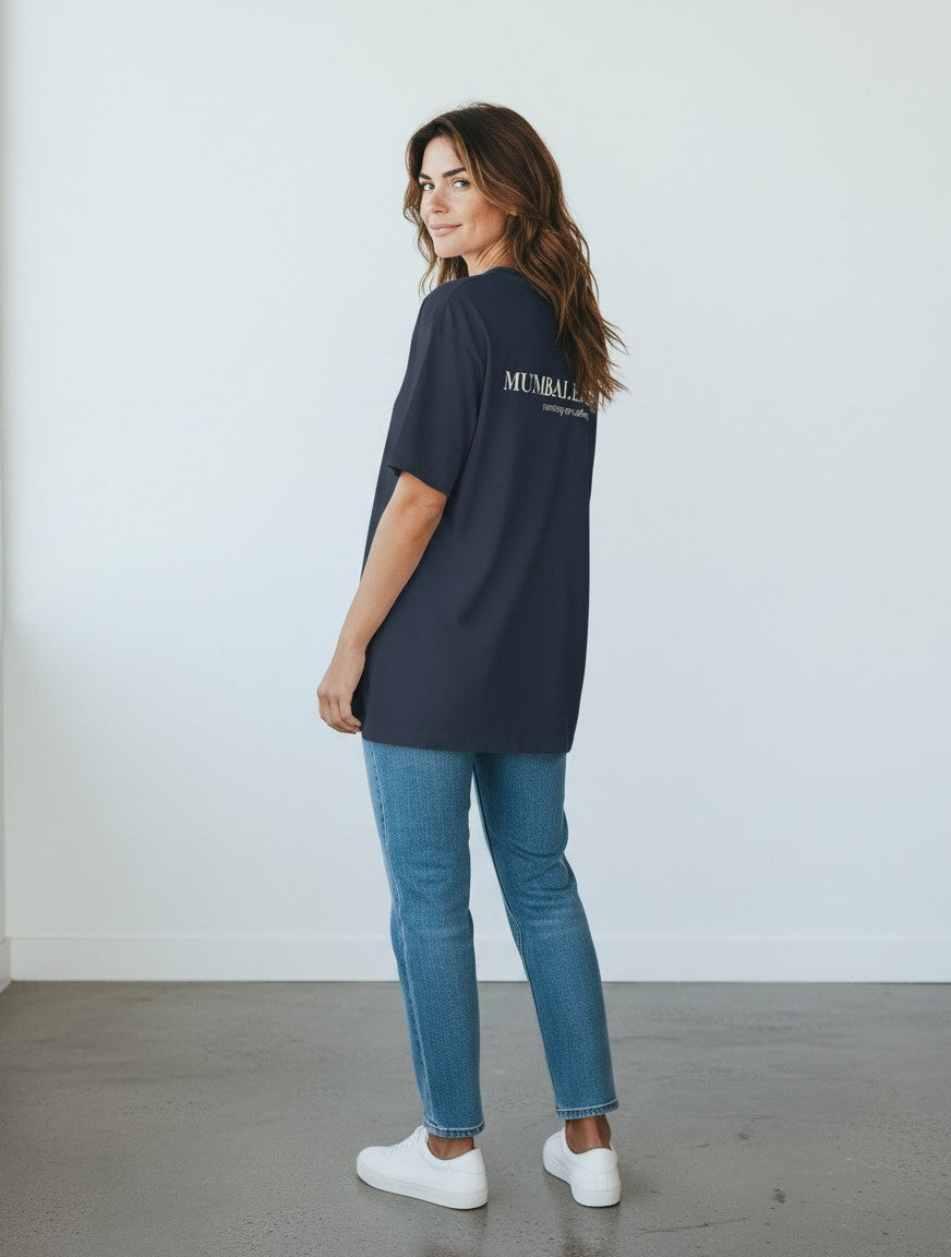 mi-DONE oversized navy blue cotton t-shirt with back graphic print worn by a woman with jeans and white sneakers