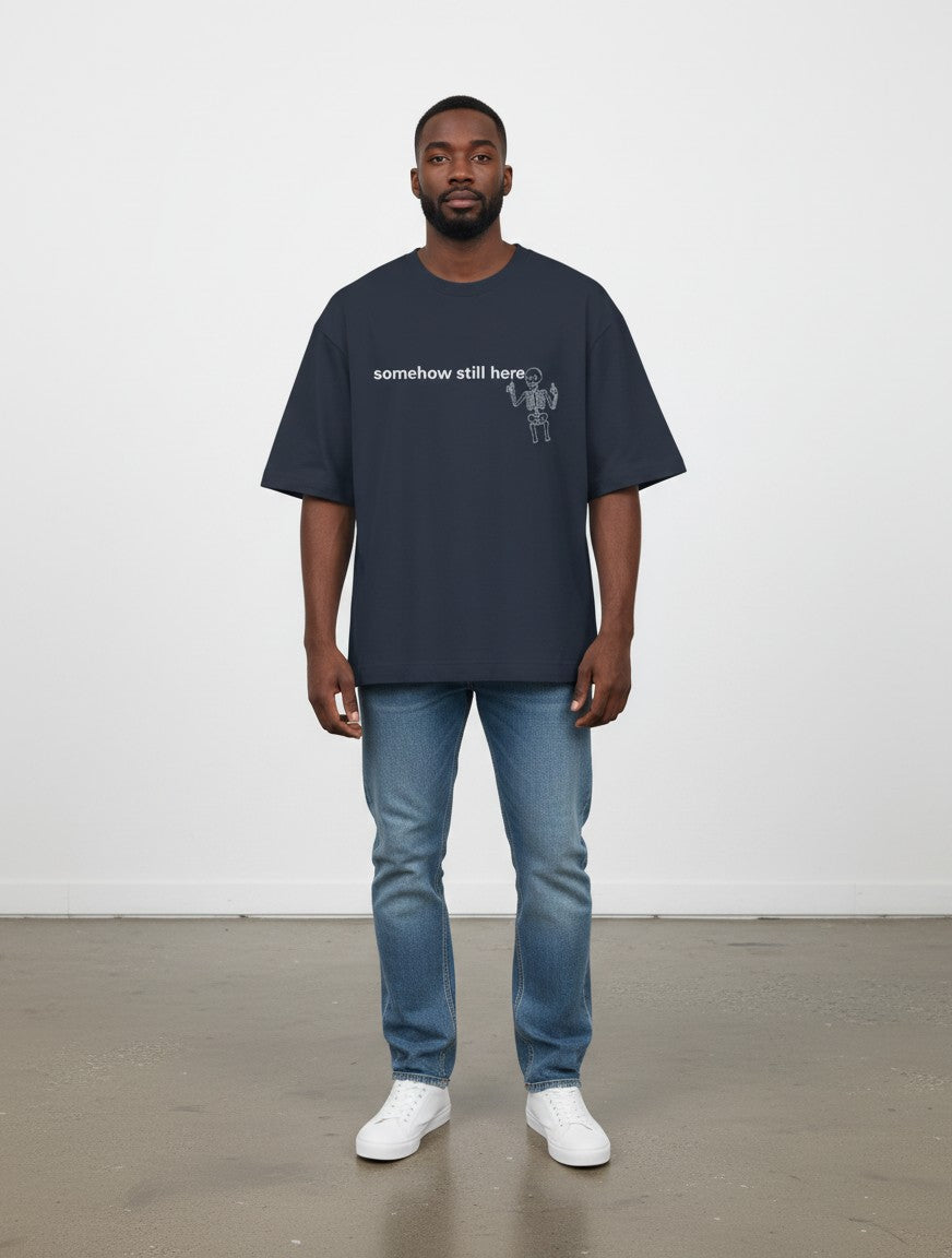 mi-DONE oversized navy cotton t-shirt with skeleton graphic print worn by a man with blue jeans and white sneakers