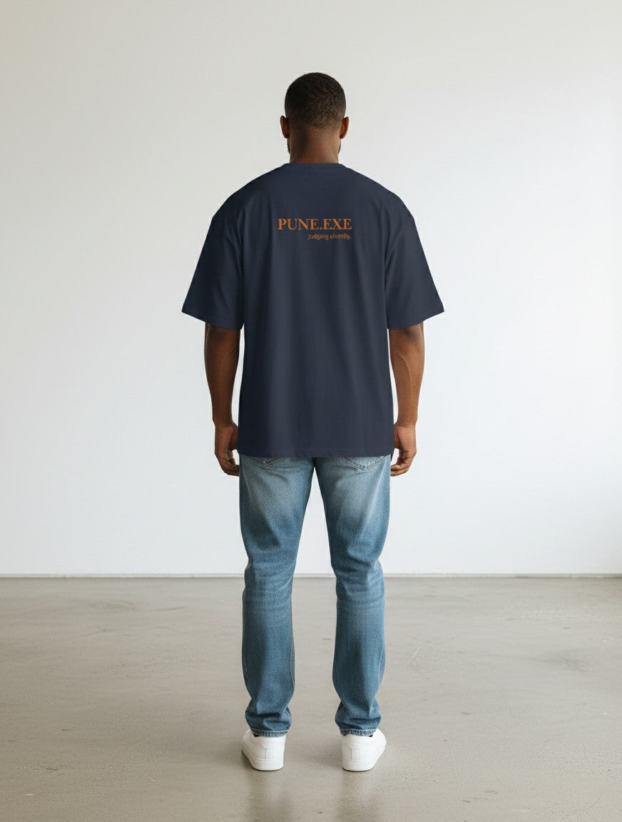 mi-DONE oversized navy blue cotton t-shirt with Pune.exe graphic print on back, worn by a man with jeans