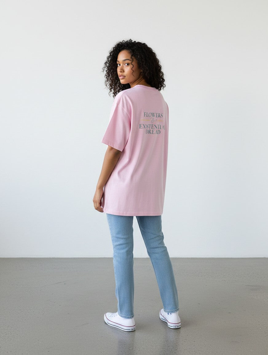 mi-DONE oversized pink cotton t-shirt with back graphic print worn by a woman with curly hair paired with jeans