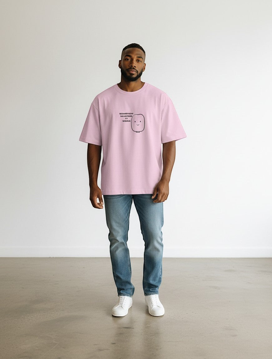 mi-DONE oversized light pink cotton t-shirt with a small graphic print, worn by a man with blue jeans and white sneakers