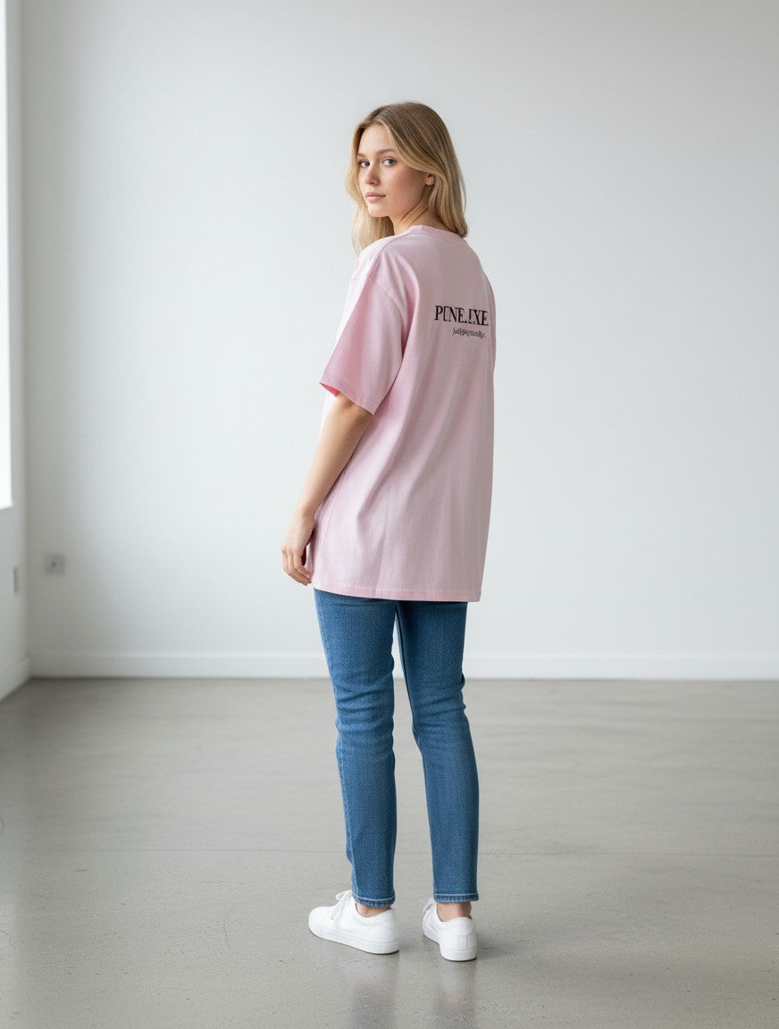 mi-DONE oversized pink cotton t-shirt with back graphic print worn by a woman with jeans and white sneakers
