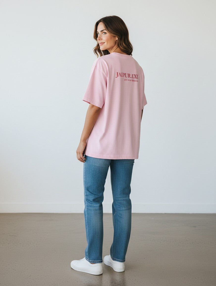 mi-DONE oversized pink cotton t-shirt with drop shoulders and Jaipur graphic print, worn by a woman with blue jeans.