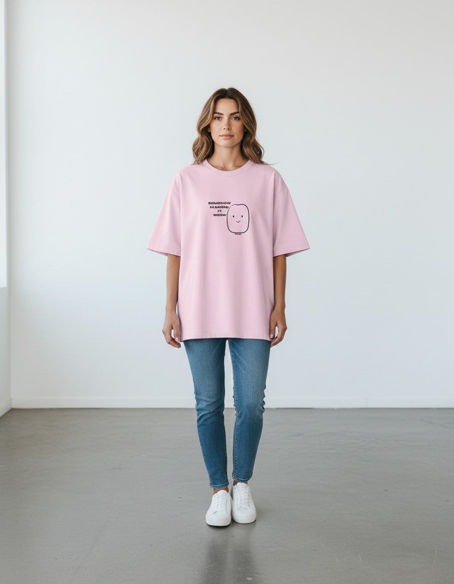 mi-DONE oversized pink cotton t-shirt with drop shoulders and a graphic print worn by a woman with blue jeans
