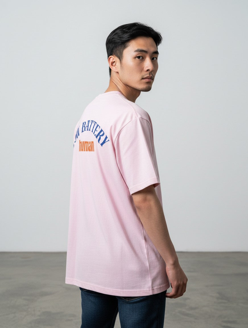 mi-DONE oversized pink cotton t-shirt with Low Battery graphic print on the back worn by a man