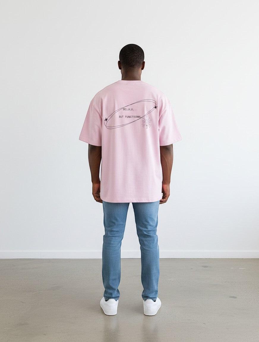 mi-DONE oversized pink cotton t-shirt with Delulu But Functional graphic print on the back worn by a man