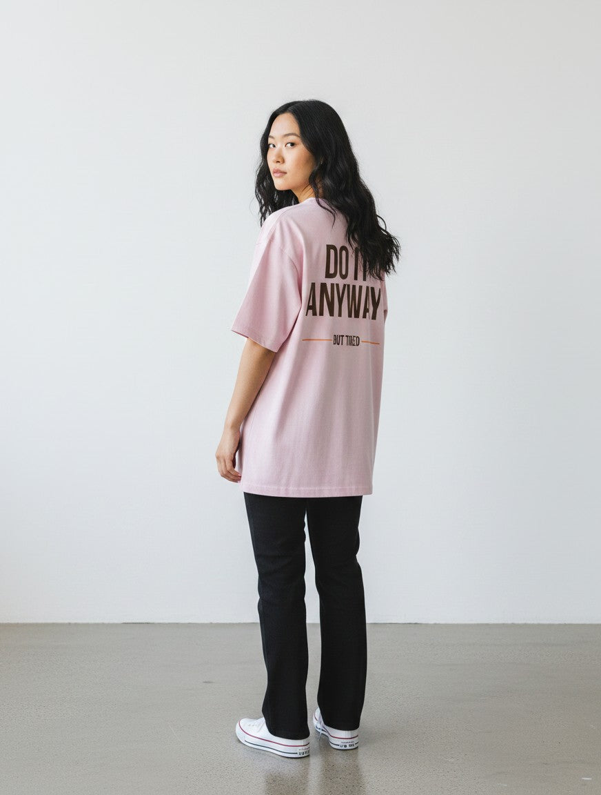 mi-DONE oversized pink cotton t-shirt with back graphic print worn by a woman with black jeans