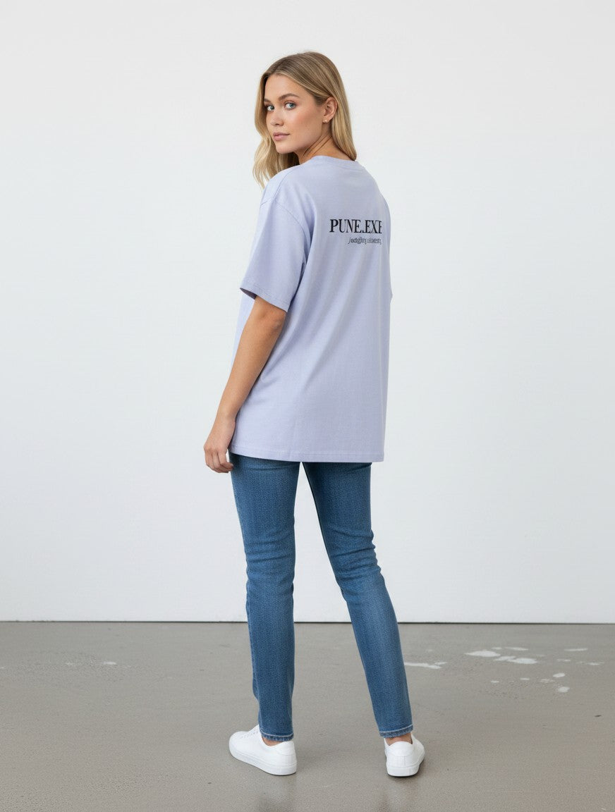 mi-DONE oversized light purple cotton t-shirt with PUNE.EXE graphic on back worn by a woman with blue jeans