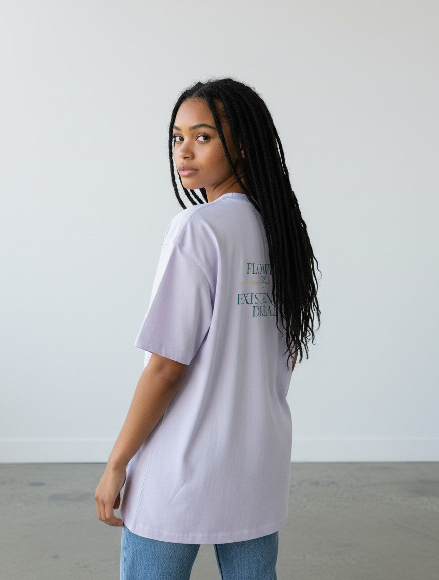 mi-DONE oversized light purple cotton t-shirt with back graphic print worn by a woman with long braided hair