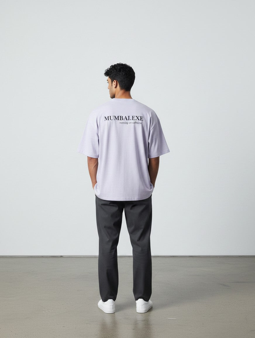 mi-DONE oversized light purple cotton t-shirt with Mumbai graphic print on back worn by a man with dark trousers