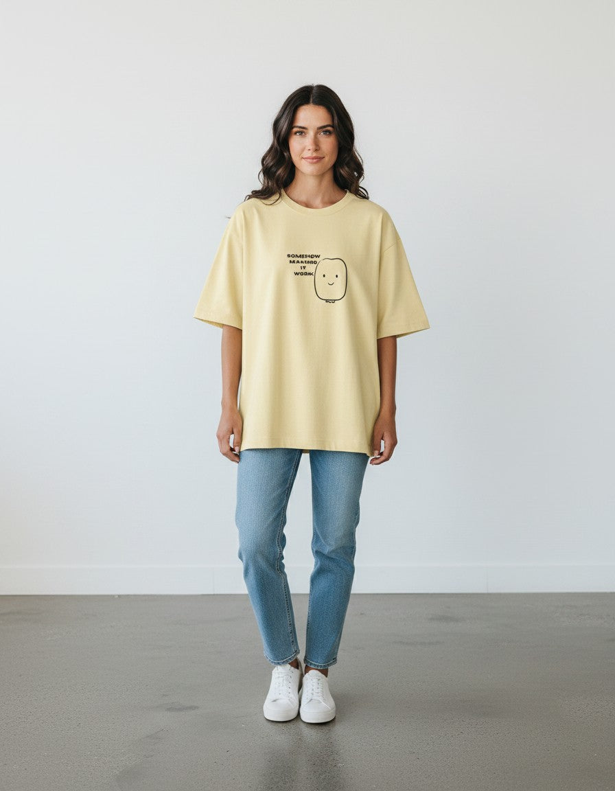 mi-DONE oversized yellow cotton t-shirt with a cute graphic print, worn by a woman with blue jeans and white sneakers