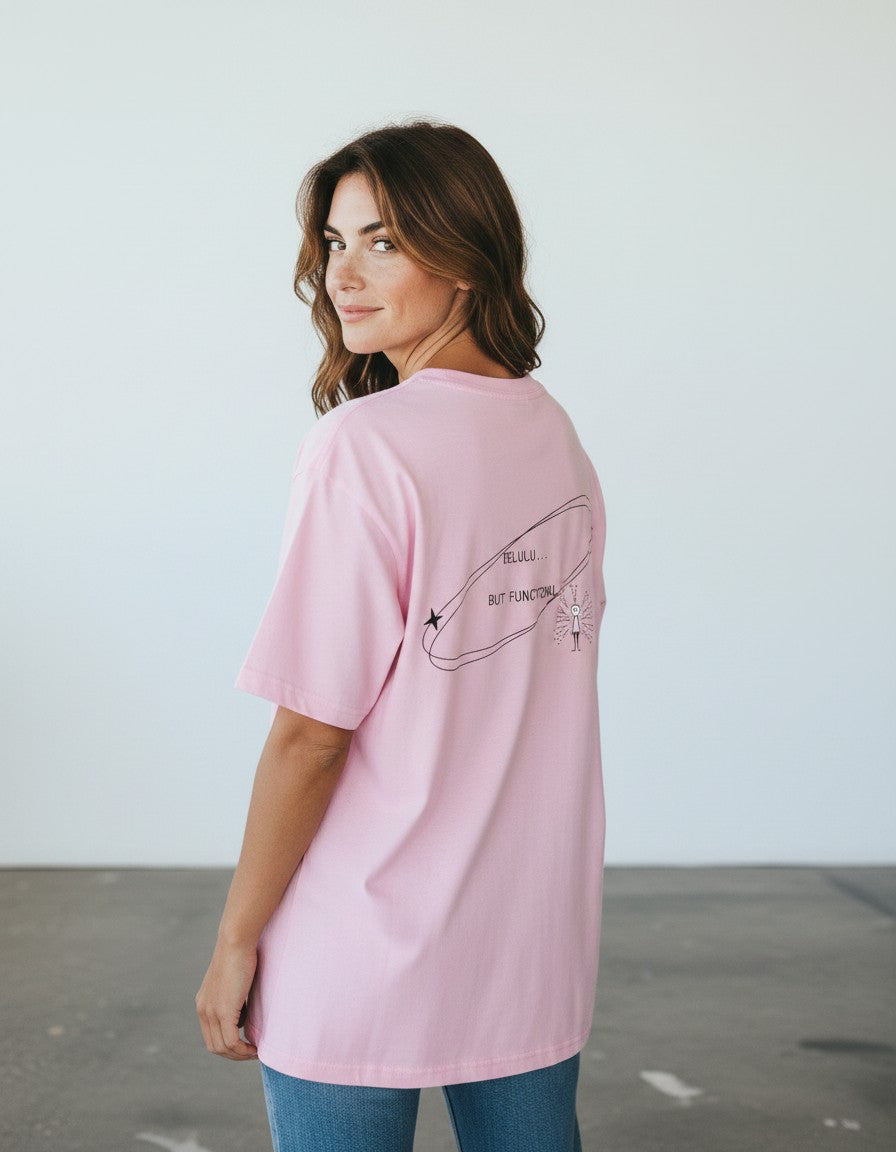 mi-DONE oversized pink cotton t-shirt with Delulu But Functional graphic print on the back worn by a woman