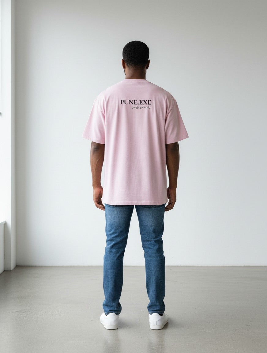 mi-DONE oversized pink cotton t-shirt with PUNE.EXE graphic on back worn by a man with blue jeans