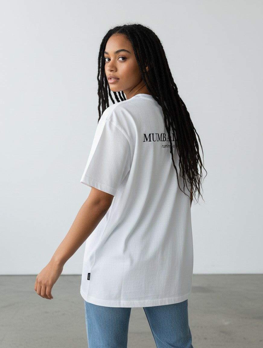 Model wearing a white mi-DONE oversized cotton t-shirt with Mumbai graphic print on the back