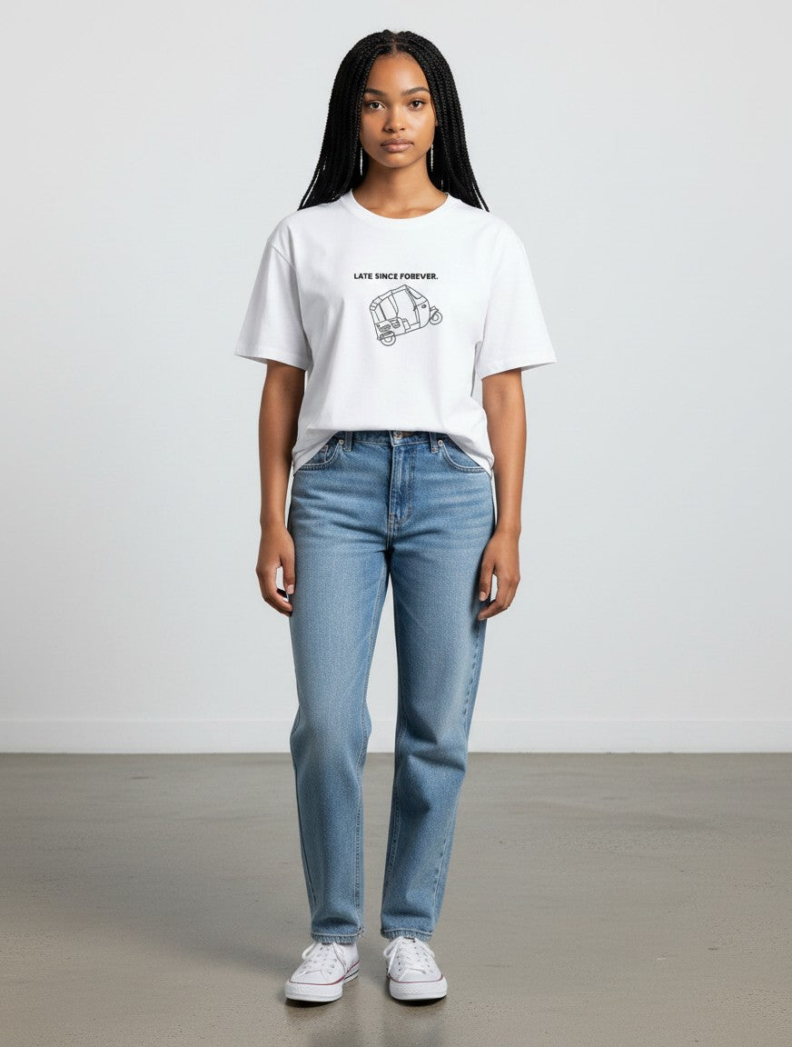 Model wearing a white mi-DONE oversized cotton t-shirt with a Mumbai rickshaw graphic print and blue jeans