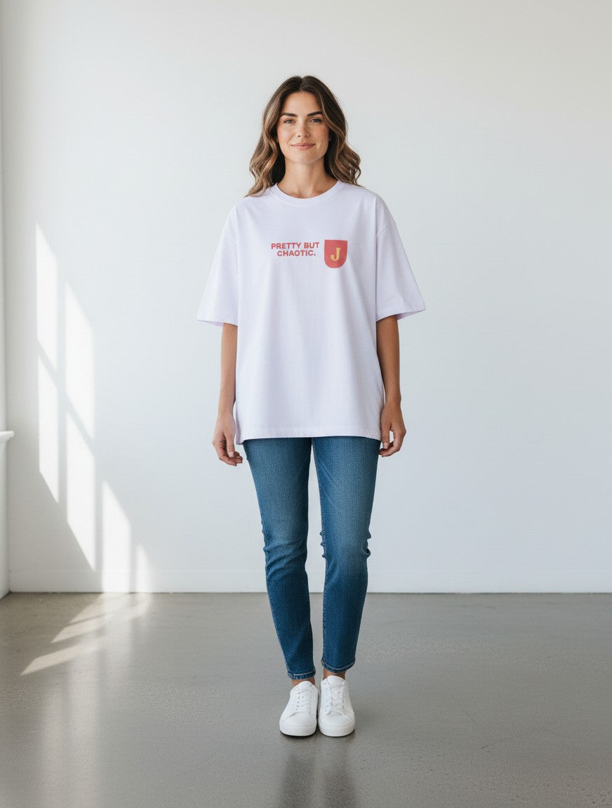 mi-DONE white oversized cotton t-shirt with Pretty But Chaotic graphic print worn by a woman with blue jeans